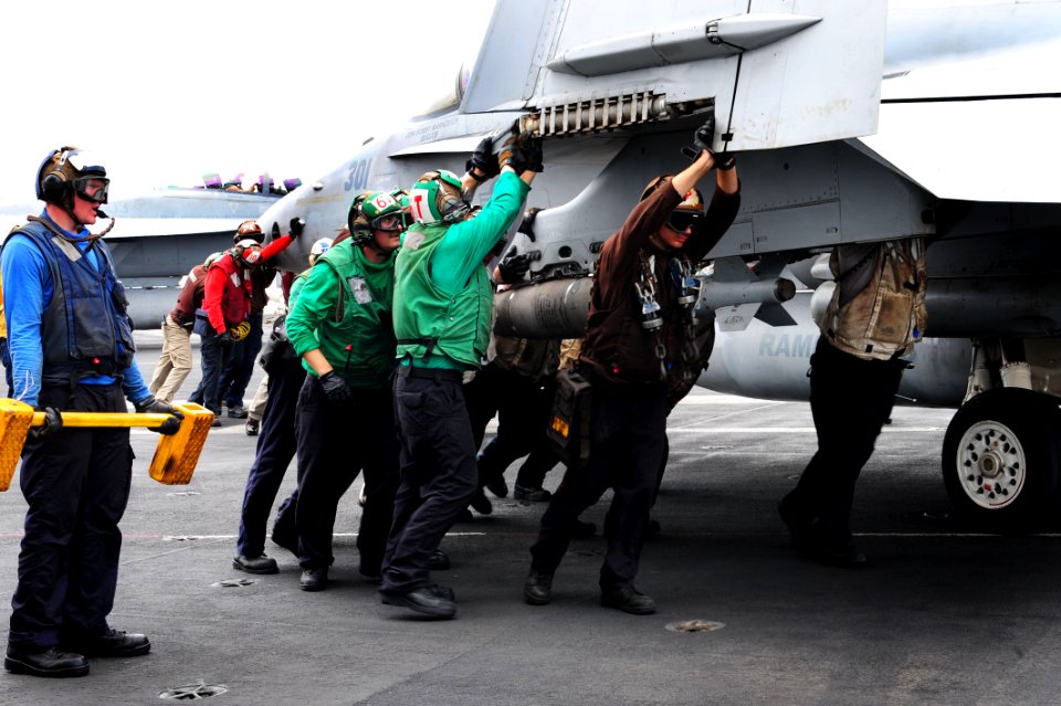 Flickr - Official U.S. Navy Imagery - Sailors push a jet.