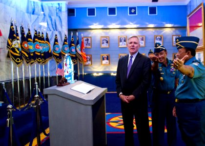 Flickr - Official U.S. Navy Imagery - SECNAV prepares to sign the guest log in the Minister of Defense's office.