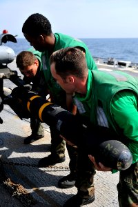 Flickr - Official U.S. Navy Imagery - Sailors remove a Hellfire missile.