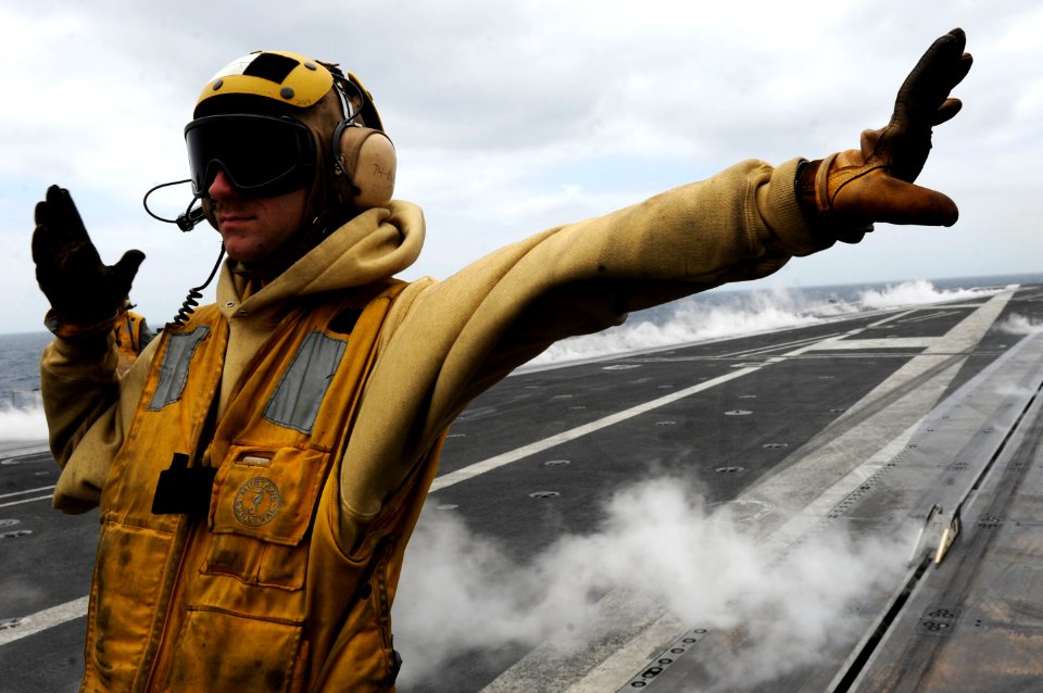 Flickr - Official U.S. Navy Imagery - St. Louis native-Sailor directs aircraft aboard carrier
