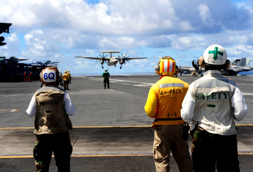 Flickr - Official U.S. Navy Imagery - Sailors watch the arrival of a E-2C Hawkeye.