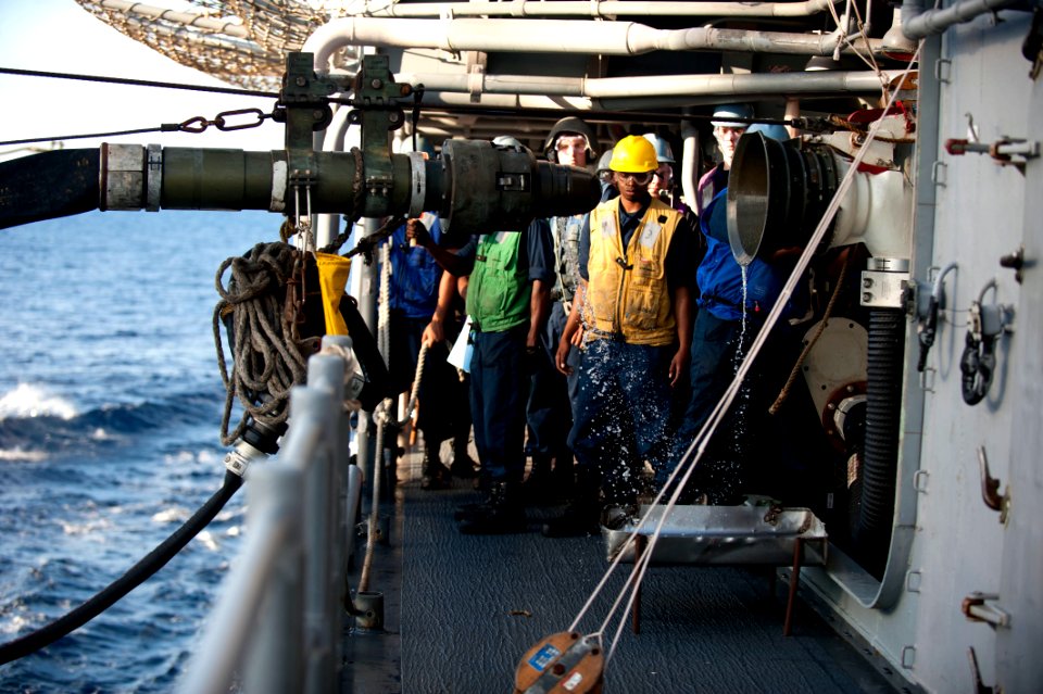 Flickr - Official U.S. Navy Imagery - Sailors watch as the fueling probe is disconnected after a replenishment at sea.