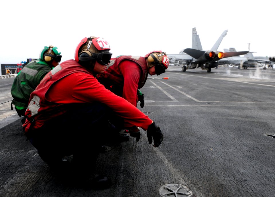 Flickr - Official U.S. Navy Imagery - Sailors wait for a jet.