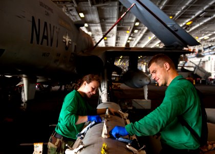 Flickr - Official U.S. Navy Imagery - Sailors wipe down an ALQ 99 jamming pod.