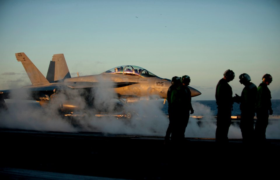 Flickr - Official U.S. Navy Imagery - Sailors wait to launch a jet.