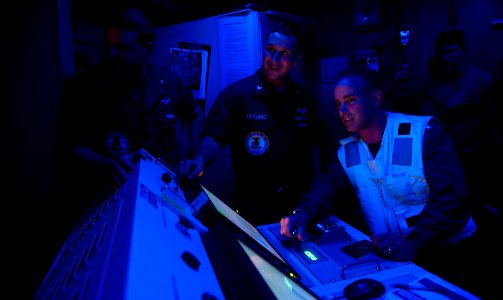 Flickr - Official U.S. Navy Imagery - The commander of Carrier Strike Group 3 operates the controls during a test cell run.