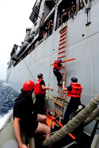 Flickr - Official U.S. Navy Imagery - Seaman Kimerly Carroll climbs down a pilot's ladder aboard the amphibious dock-landing ship USS Gunston Hall.