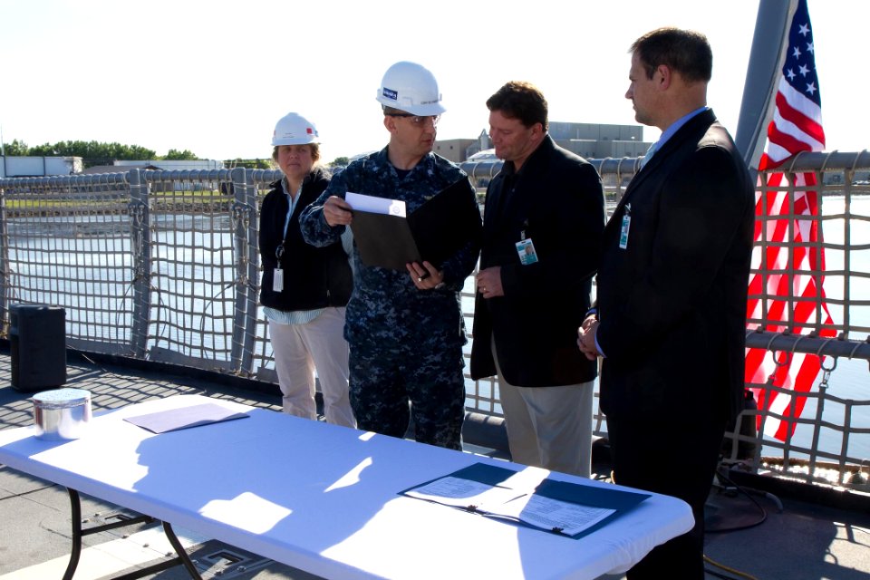 Flickr - Official U.S. Navy Imagery - The Navy’s Supervisor of Shipbuilding reviews the official document that will formally transfer ownership of the littoral combat ships.