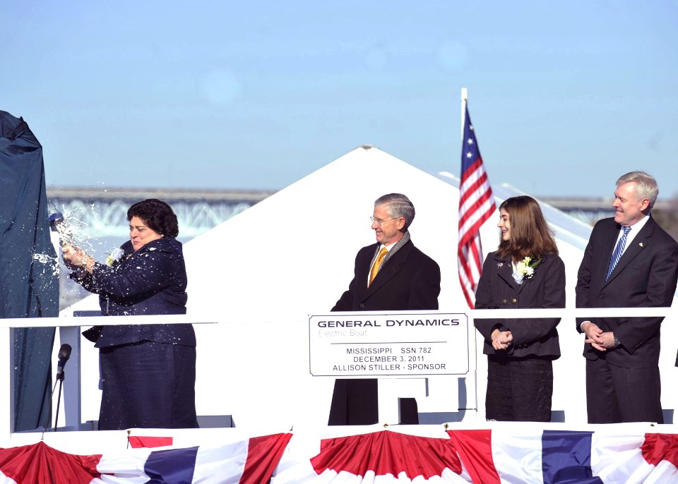 Flickr - Official U.S. Navy Imagery - Ship sponsor Allison Stiller, left, breaks a bottle of champagne against the Virginia-class attack submarine Pre-Commissioning Unit Mississippi.
