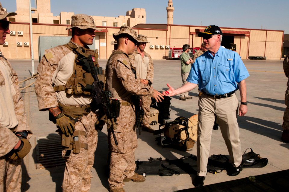 Flickr - Official U.S. Navy Imagery - The SECNAV hands a coin to a Marine assigned to the 11th Marine Expeditionary Unit.