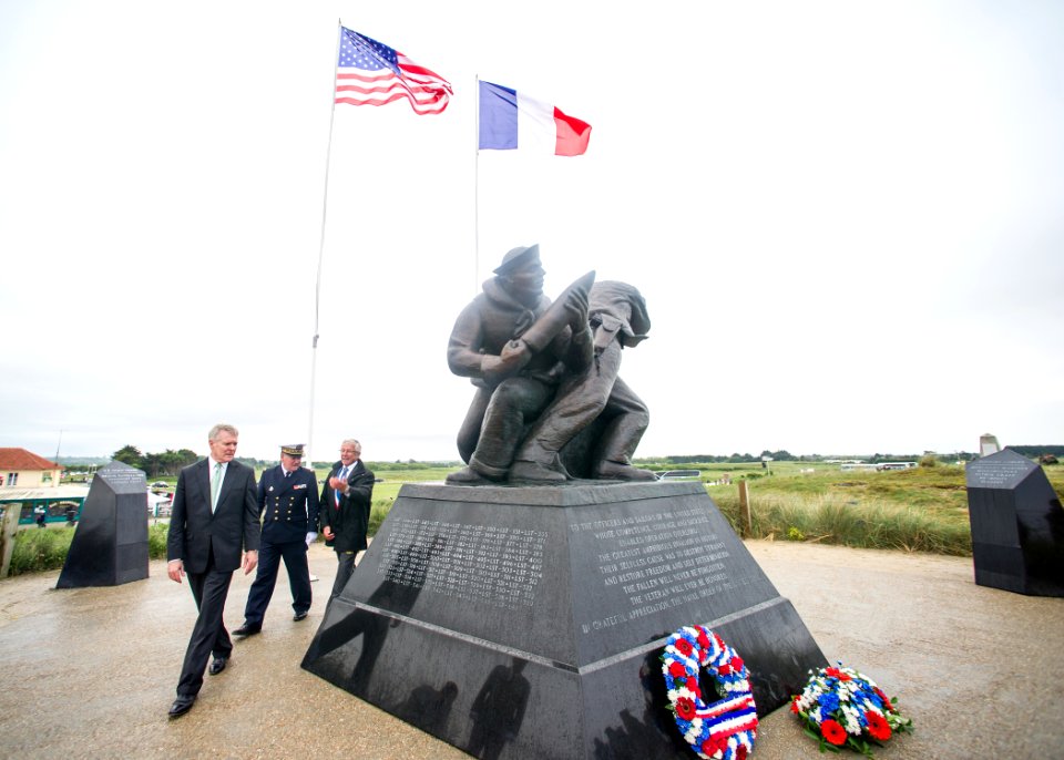 Flickr - Official U.S. Navy Imagery - The SECNAV reads the inscription on the U.S. Navy memorial honoring Sailors lost during the D-Day invasion of Normandy at Utah Beach in Sainte Marie du Mont, France.
