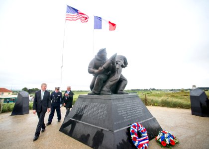 Flickr - Official U.S. Navy Imagery - The SECNAV reads the inscription on the U.S. Navy memorial honoring Sailors lost during the D-Day invasion of Normandy at Utah Beach in Sainte Marie du Mont, France.