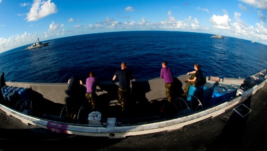 Flickr - Official U.S. Navy Imagery - The Arleigh Burke-class guided-missile destroyers USS Kidd (DDG 100), USS Dewey (DDG 105) and USS Pinckney (DDG 91) are underway with the Nimitz-class aircraft carrier USS John C. Stennis. photo