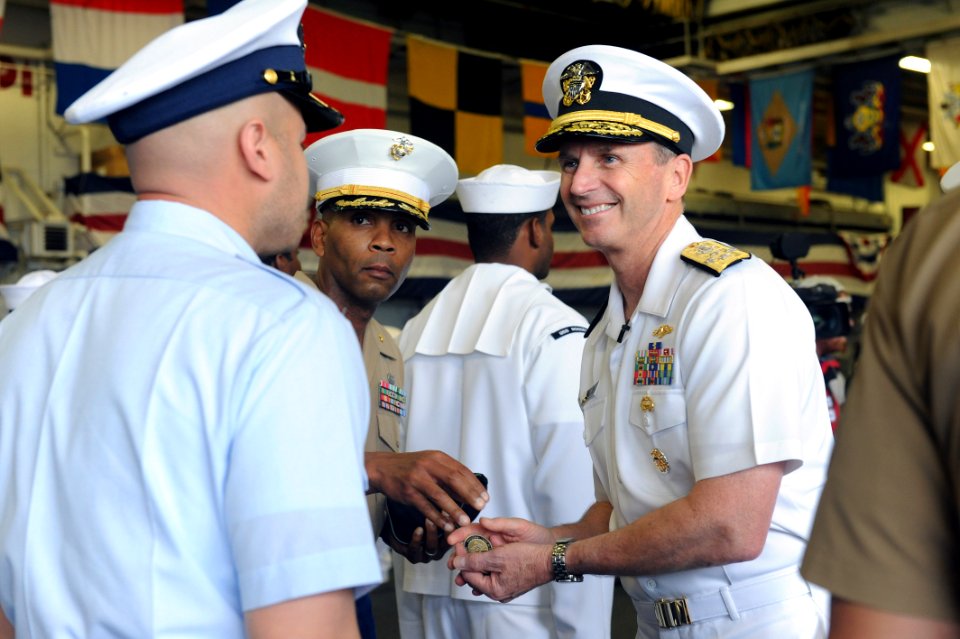 Flickr - Official U.S. Navy Imagery - The CNO gives coins to reenlistees in the hangar bay of USS Wasp.