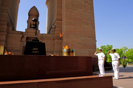 Flickr - Official U.S. Navy Imagery - The CNO salutes the Eternal Flame at the Navy Gate War Memorial after placing a wreath at the monument.