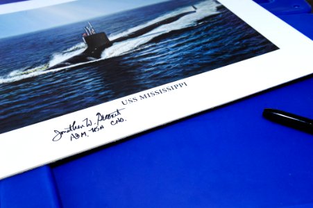 Flickr - Official U.S. Navy Imagery - The CNO's signature is on a photo for a Navy supporter before the commissioning ceremony for the Navy's ninth Virginia-class attack submarine USS Mississippi.