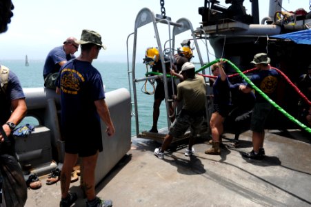 Flickr - Official U.S. Navy Imagery - U.S. Navy divers help bring Jamaican divers on the deck.