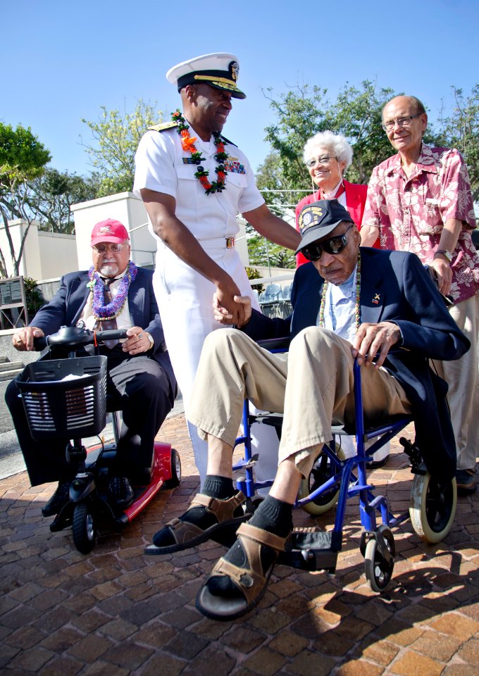 Flickr - Official U.S. Navy Imagery - The commander of Navy Region Hawaii, Naval Surface Group Middle Pacific greets surviving members of the Tuskegee Airmen at a ceremony.