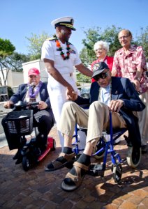 Flickr - Official U.S. Navy Imagery - The commander of Navy Region Hawaii, Naval Surface Group Middle Pacific greets surviving members of the Tuskegee Airmen at a ceremony.