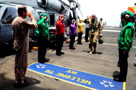 Flickr - Official U.S. Navy Imagery - The deputy commander of the International Security Assistance Force walks through rainbow sideboys.