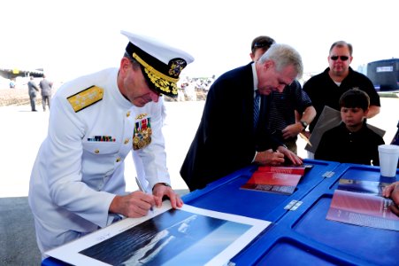 Flickr - Official U.S. Navy Imagery - The SECNAV and CNO sign photos before the commissioning ceremony for the Navy's ninth Virginia-class attack submarine USS Mississippi.