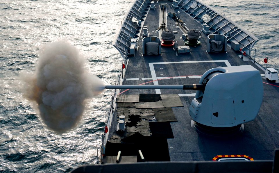 Flickr - Official U.S. Navy Imagery - The Ticonderoga-class guided-missile cruiser USS Cape St. George (CG 71) fires a round from the forward MK-45 lightweight 5-inch gun.