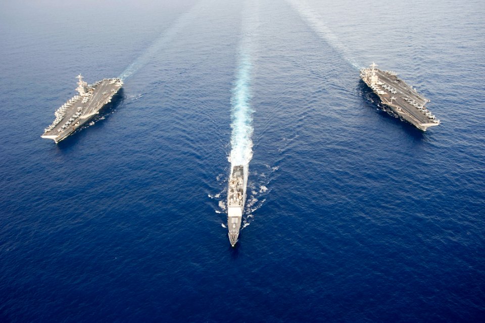 Flickr - Official U.S. Navy Imagery - Two Navy aircraft carriers together at sea.