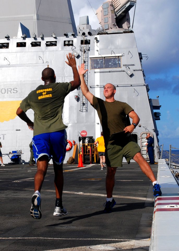 Flickr - Official U.S. Navy Imagery - Two Marines high-five after a 5k run.