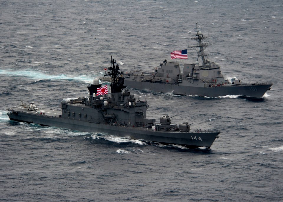 Flickr - Official U.S. Navy Imagery - US and Japanese ship sail alongside each other during a passing exercise.