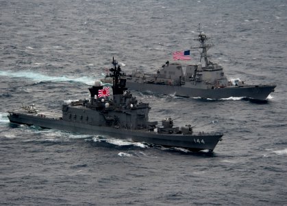 Flickr - Official U.S. Navy Imagery - US and Japanese ship sail alongside each other during a passing exercise.