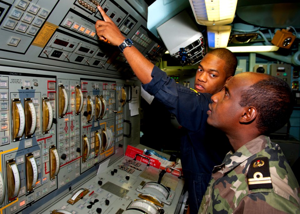 Flickr - Official U.S. Navy Imagery - US Sailor Djiboutian navy sailor the main propulsion console aboard USS Samuel B. Roberts