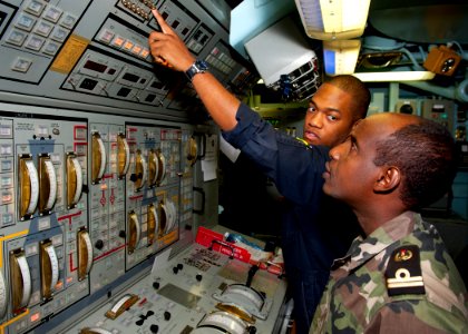 Flickr - Official U.S. Navy Imagery - US Sailor Djiboutian navy sailor the main propulsion console aboard USS Samuel B. Roberts