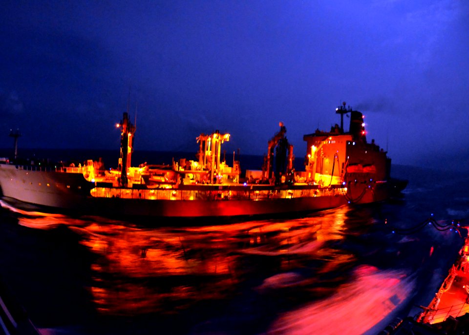 Flickr - Official U.S. Navy Imagery - USNS Henry J. Kaiser performs a nighttime replenishment at sea.
