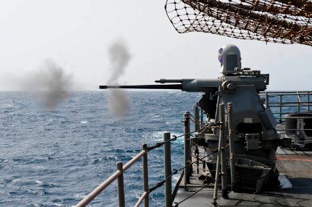 Flickr - Official U.S. Navy Imagery - USS Cape St. George fires one of its 25mm chain guns during a pre-aim calibration fire.