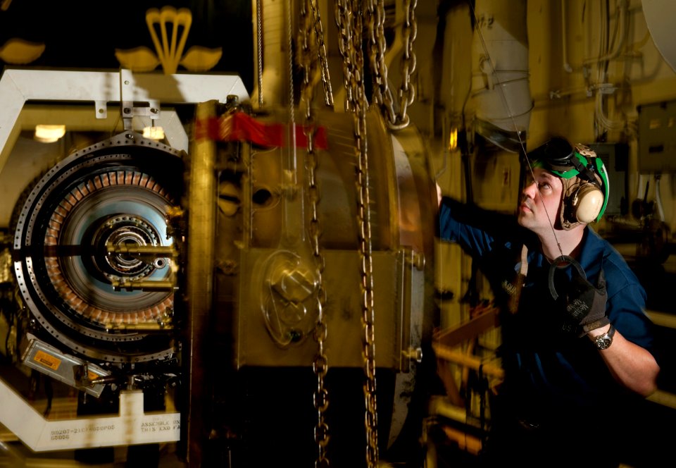 Flickr - Official U.S. Navy Imagery - USS Carl Vinson Sailor reassembles a turbofan (1)