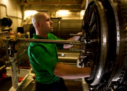Flickr - Official U.S. Navy Imagery - USS Carl Vinson Sailor reassembles a turbofan