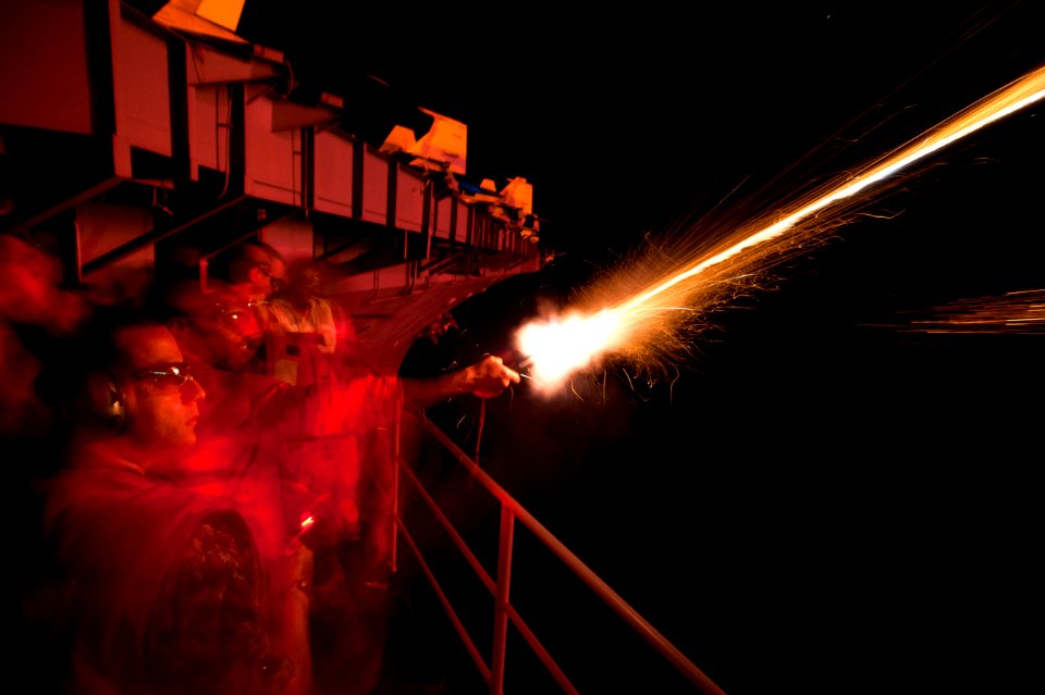 Flickr - Official U.S. Navy Imagery - USS Carl Vinson Sailors light off flares to bring in the new year.