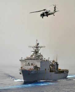 Flickr - Official U.S. Navy Imagery - USS Comstock with Sea Hawk flying overhead.