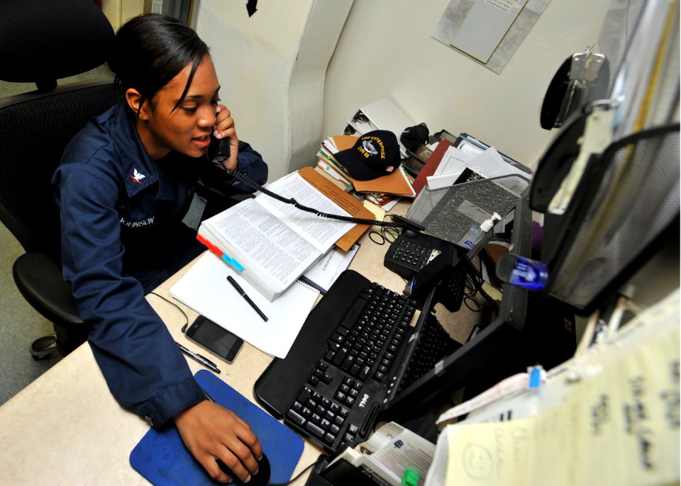 Flickr - Official U.S. Navy Imagery - USS Enterprise Sailor helps her shipmates with legal paperwork.