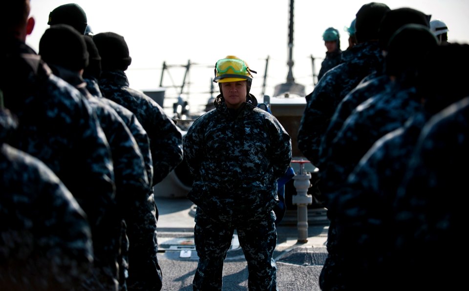 Flickr - Official U.S. Navy Imagery - USS Stockdale Sailor leads her shipmates as ship gets underway.