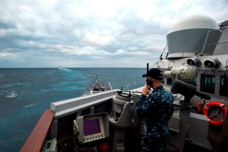 Flickr - Official U.S. Navy Imagery - USS Stockdale Sailor communicates with other ships in the formation.