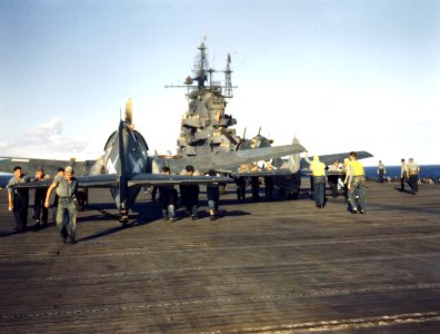 Flight deck crewmen respot Grumman F6F-3 Hellcats of VF-5 aboard USS Yorktown (CV-10), circa in late 1943 (80-G-K-15277)