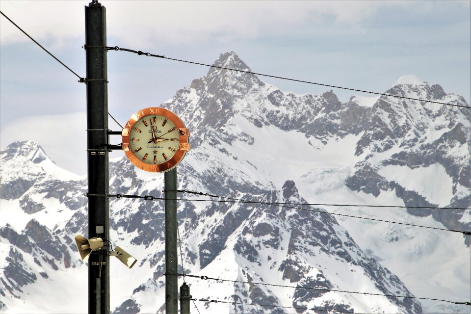 Clock snow mountain