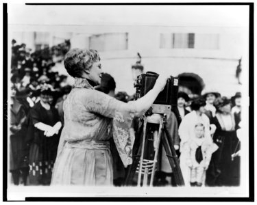 Florence Kling Harding operating a movie camera on the lawn at the White House, Washington, D.C. LCCN2002713192