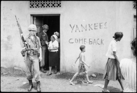 Food distribution in front of Yankees come back sign, Santo Domingo, May 9., 1965 - NARA - 541807