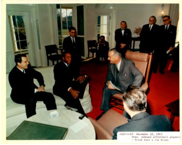 Football players and President Johnson photo