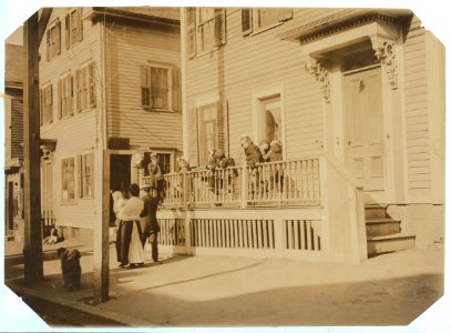For Child Welfare Exhibit 1912-13.) Exterior of Sprague House Settlement Providence, on Saturday morning. The house was so full that these children could not go in LOC nclc.04796