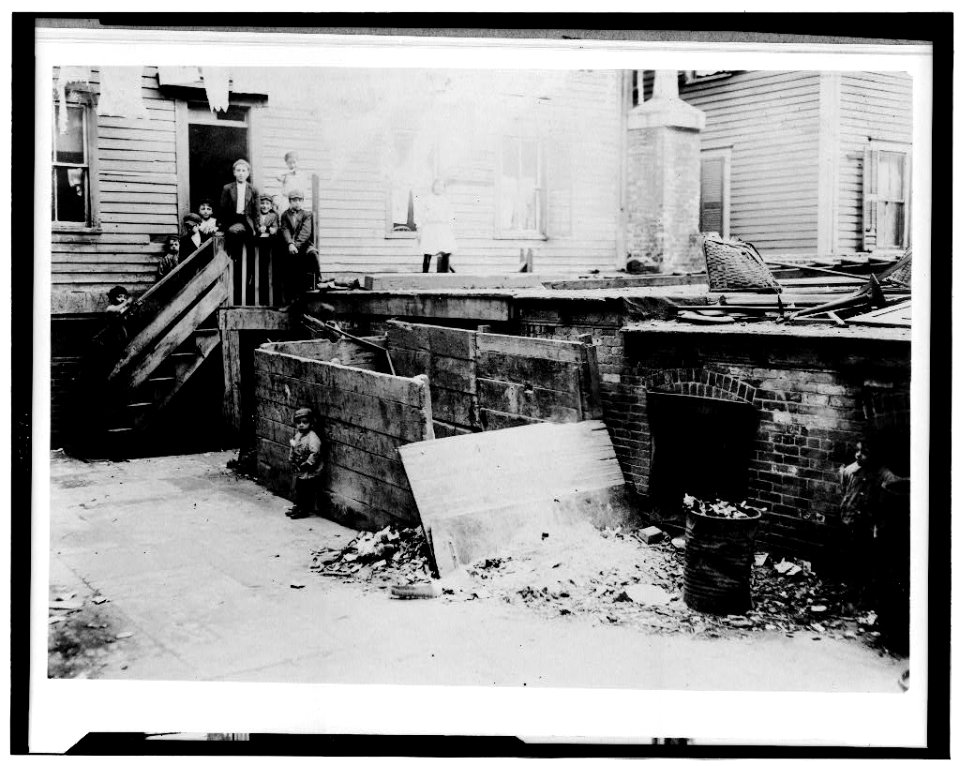 For Child Welfare Exhibit 1912-13.) Entrance to the crowded, dirty house of a Midwife, rear tenement on Spruce Street, Providence, R.I LOC cph.3c02396