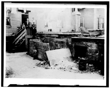 For Child Welfare Exhibit 1912-13.) Entrance to the crowded, dirty house of a Midwife, rear tenement on Spruce Street, Providence, R.I LOC cph.3c02396