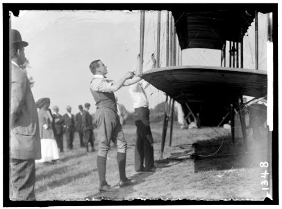GRAHAME-WHITE, CLAUDE. FIXING WING OF HIS FORMAN PLANE LCCN2016863813